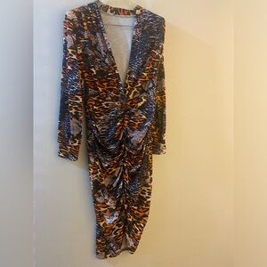 This is a sexy low cut dress. Fitted with a beautiful leopard pattern.